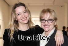 Una Riley standing with her daughter, English actress Talulah Riley, at an event.