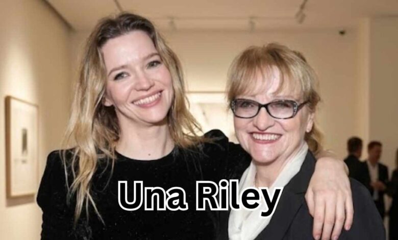 Una Riley standing with her daughter, English actress Talulah Riley, at an event.