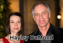 Actress Hayley DuMond and her husband, actor Keith Carradine, smiling and posing for a photograph at a formal function.