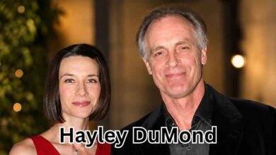 Actress Hayley DuMond and her husband, actor Keith Carradine, smiling and posing for a photograph at a formal function.