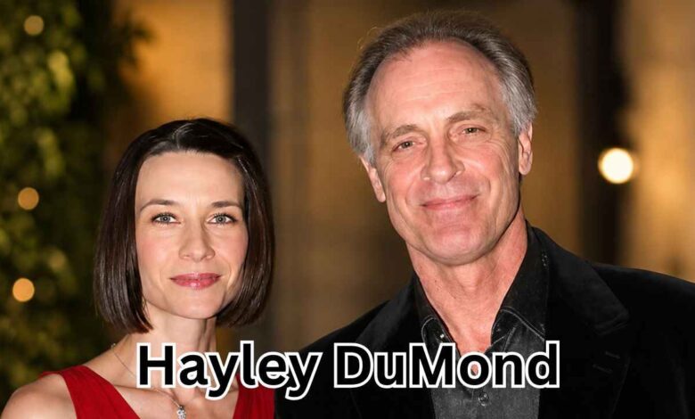 Actress Hayley DuMond and her husband, actor Keith Carradine, smiling and posing for a photograph at a formal function.